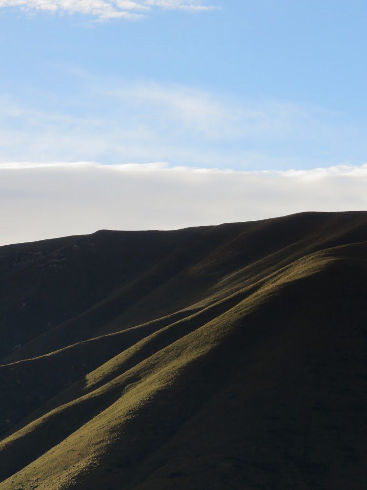 Silhouetted mountain ridgelines at dusk